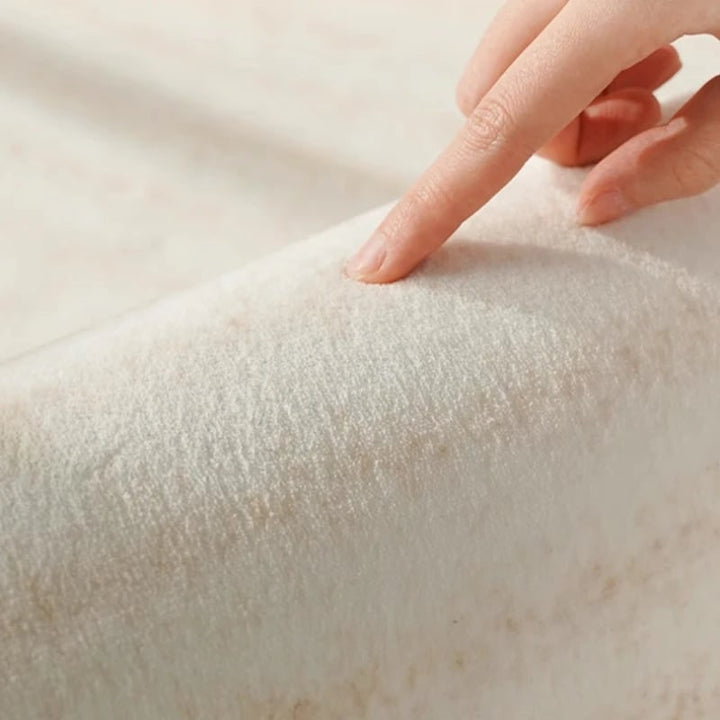 Area Rug with Irregular Wavy Edge and Textured Plush Pile Pattern