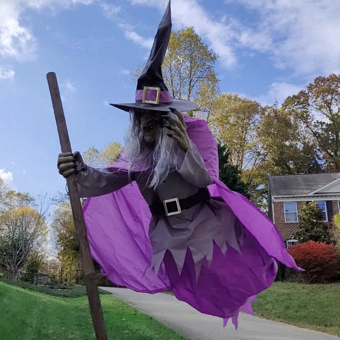 Life-Size Flying Witch Halloween Decor and Prop with Glowing LED Eyes and Broomstick Stand